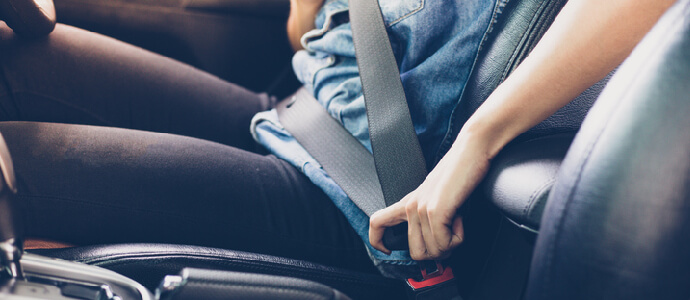 woman fastening seat belt in the car,passenger injury