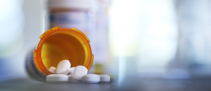 Pills spilling out of bottle