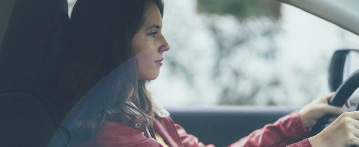 young teenage girl driving a car