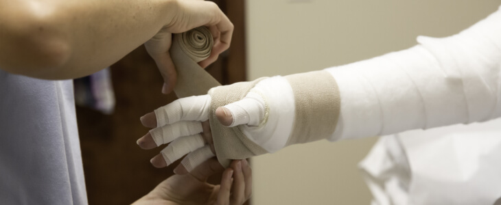 Person with whole arm and fingers bandaged