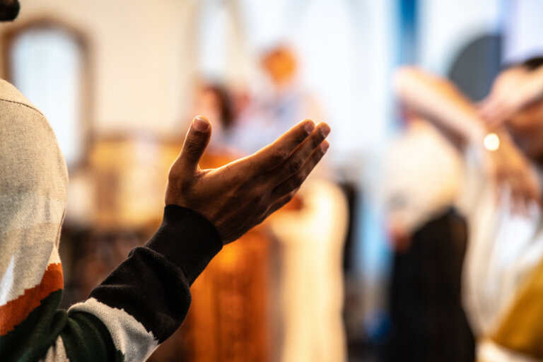 Close-up of a man worshiping in a church