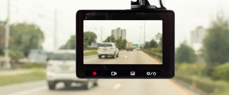 Dash cam installed at front windshield in car