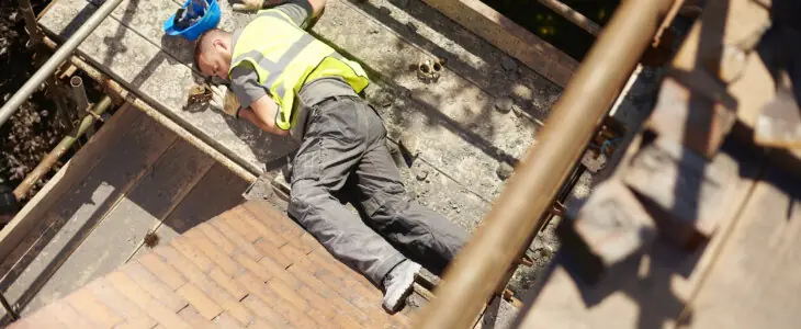 a builder or roofer has fallen from the top elevation of scaffold on a construction site